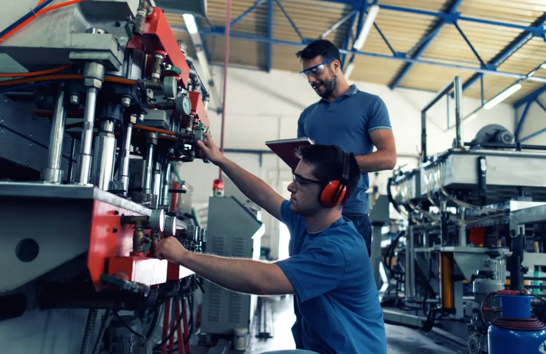 two factory engineers are spoting production line gaps using Odoo ERP Insights